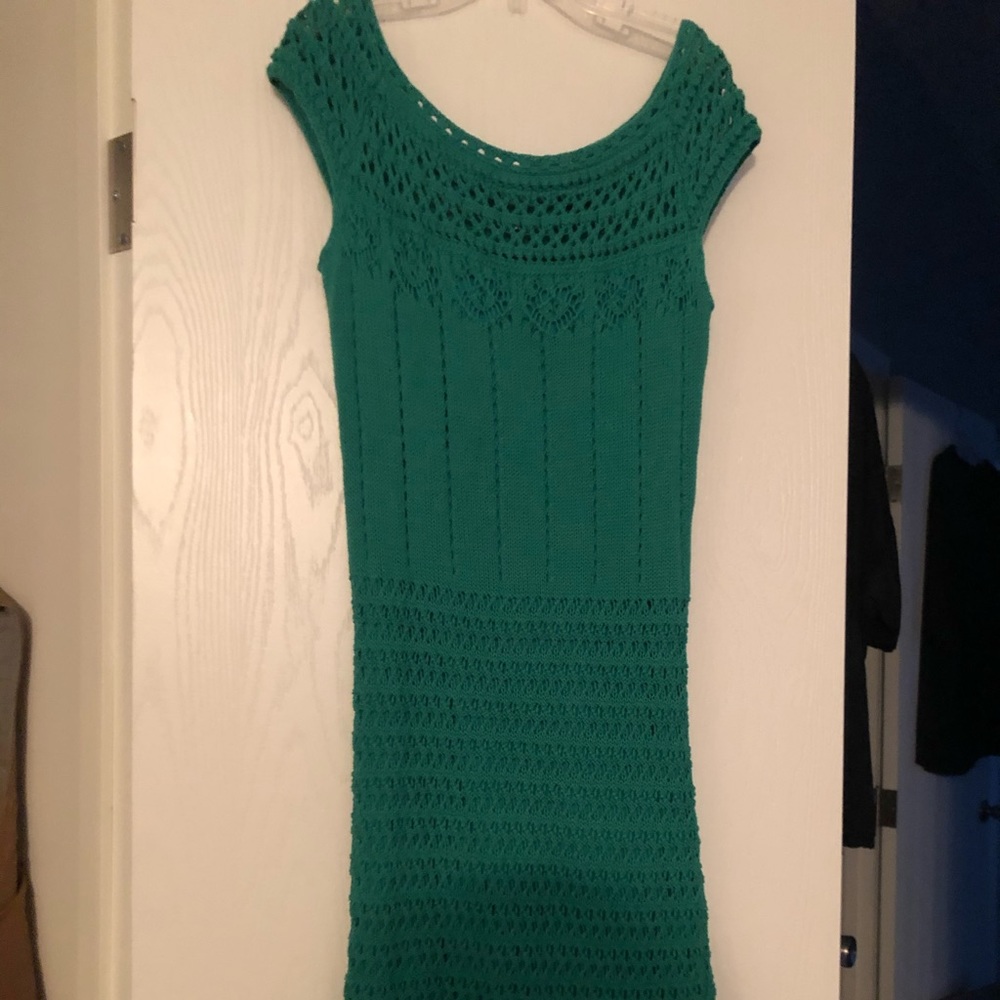Fitted below the knee green knit dress